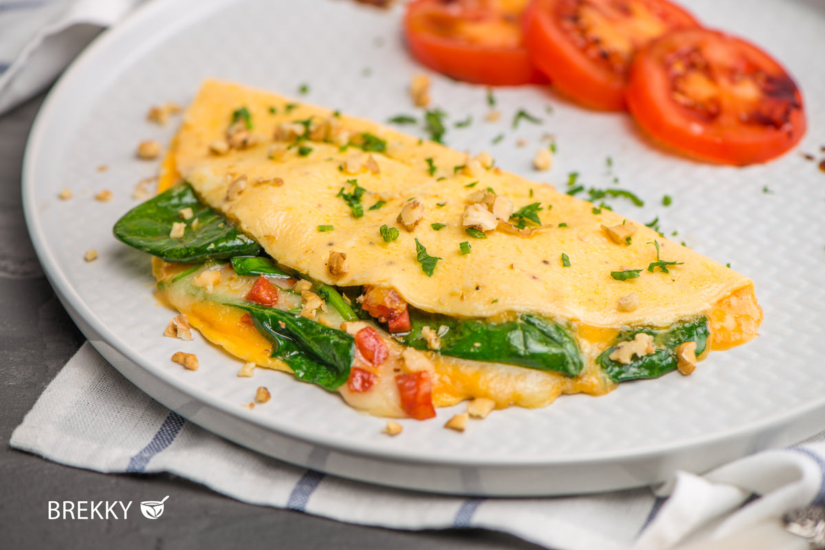 Omelett mit Spinat und gegrillten Tomaten